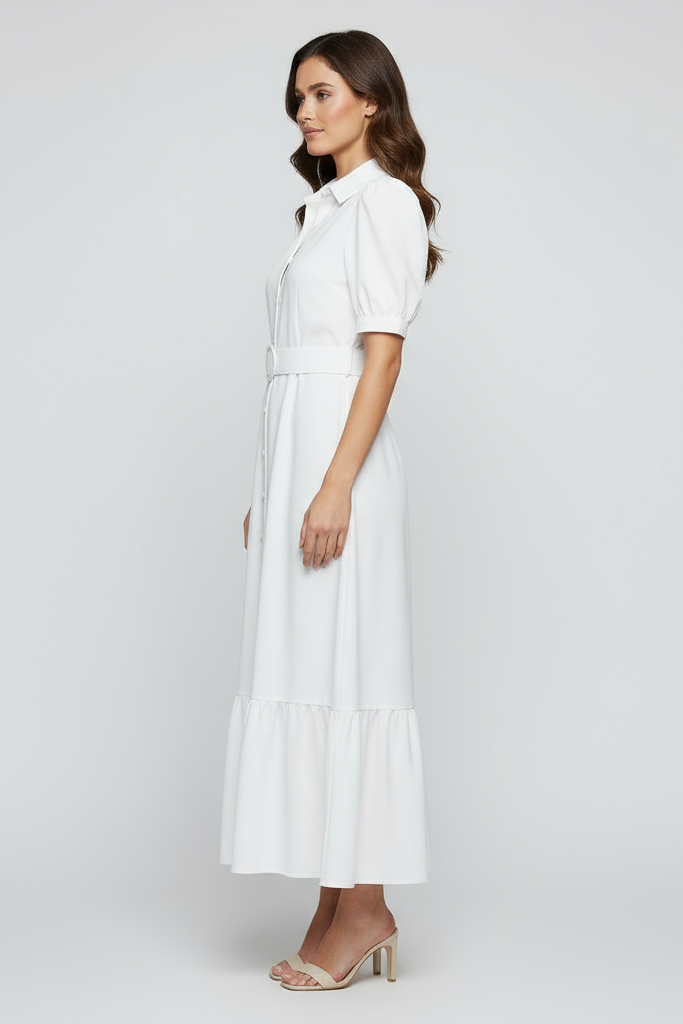 Modelo com vestido branco virada para o lado esquerdo